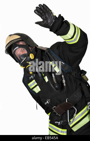 Firefighter in self contained breathing apparatus hand shows gesture OK Stock Photo