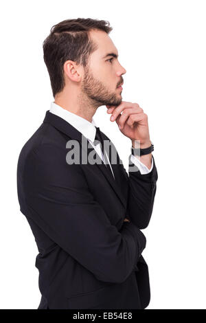 Thoughtful businessman touching his chin Stock Photo