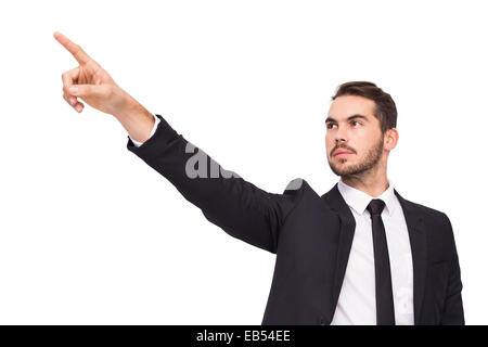 Thoughtful businessman pointing his finger Stock Photo