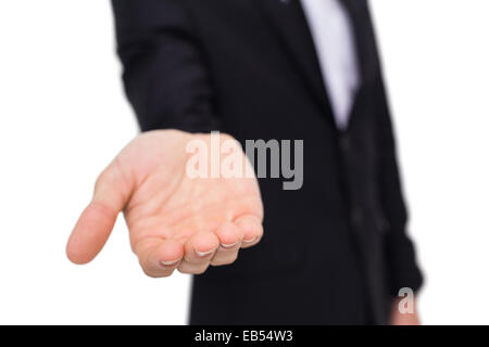 Businessman holding out his hands to the camera Stock Photo