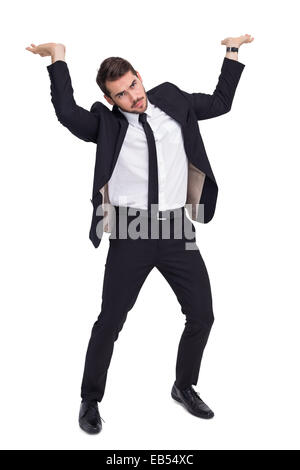 Businessman in suit lifting up something heavy Stock Photo