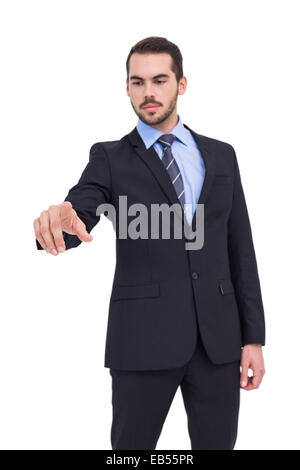 Cheerful businessman pointing at camera Stock Photo