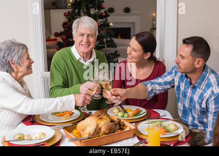 Portrait of happy family toasting at christmas dinner Stock Photo
