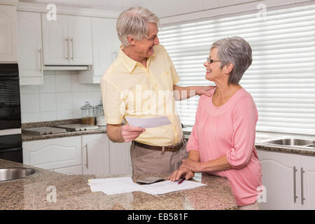 Senior couple paying their bills Stock Photo