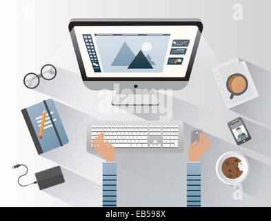 Designer working on computer at desk Stock Vector