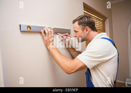 Construction worker using spirit level Stock Photo