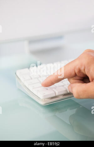 Close up of a finger pressing on key Stock Photo
