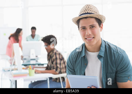 Young creative man using his tablet Stock Photo