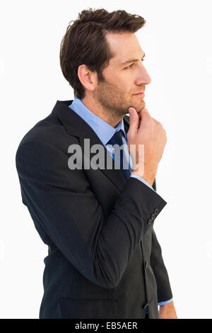 Thinking businessman touching his chin Stock Photo