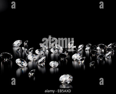 Assorted cut and polished diamonds on black background Stock Photo