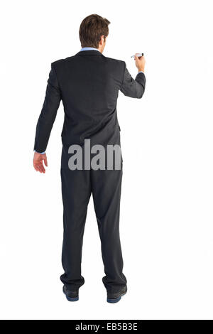 Businessman standing back to camera writing with marker Stock Photo