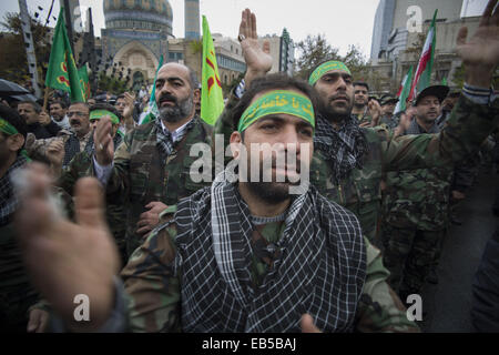 Tehran, Iran. 26th Nov, 2014. Members of the Basij paramilitary force beat themselves during a religious ceremony in a rally to mark the Basij week in central Tehran. © Morteza Nikoubazl/ZUMA Wire/Alamy Live News Stock Photo