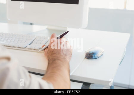 Businessman typing on computer keyboard Stock Photo