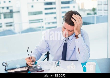 Businessman looking at documents Stock Photo