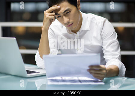 Young businessman working in office Stock Photo