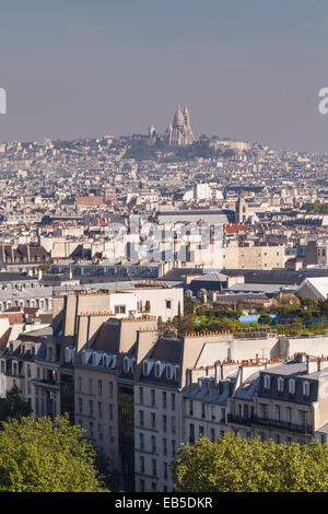 Looking over the rooftops of Paris. Sacre Coeur can be seen in the background. Stock Photo
