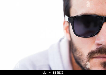 Close up of serious man wearing sunglasses Stock Photo