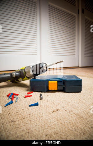 Portable drill in dusty workshop Stock Photo