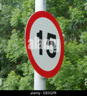 15 miles an hour speed road sign close up with bullet holes Stock Photo