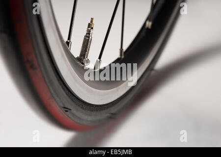 racing road bike wheel rim spokes and valve Stock Photo