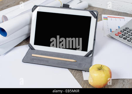 Digital tablet with apple on the desk Stock Photo