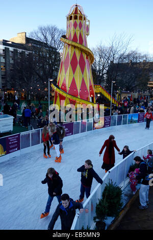 Saturday 22nd November 2014. Children enjoy the newly opened ice rink in St Andrews Square, Edinburgh. Stock Photo