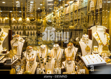 Gold jewelries displayed in a store window. Souq Muttrah, Muscat, Oman. Stock Photo