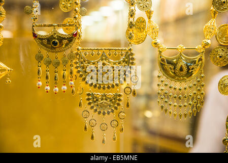 Gold jewelries displayed in a store. Souq Muttrah, Muscat, Oman. Stock Photo