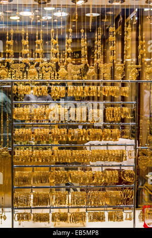 Gold jewelries displayed in a store window. Souq Muttrah, Muscat, Oman. Stock Photo