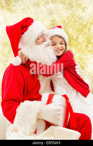 smiling little girl with santa claus Stock Photo