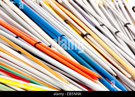 closeup group of colorful paired knitting needles Stock Photo