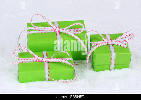 Christmas gifts in boxes with snow in winter Stock Photo