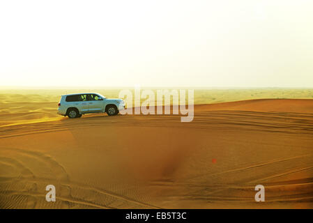 The Dubai desert trip in off-road car is major tourists attraction. Stock Photo