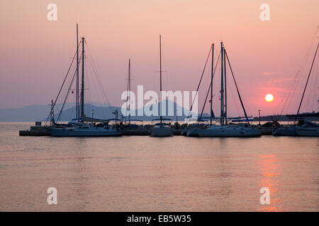 Frikes, Ithaca, Ionian Islands, Greece. View across the harbour at sunrise, the distant island of Atokos visible. Stock Photo