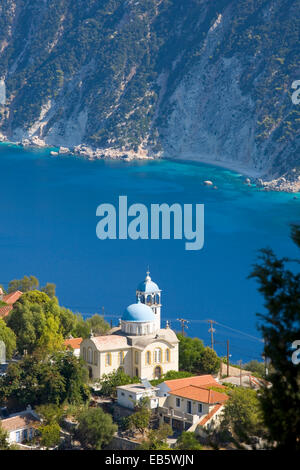 Exogi, Ithaca, Ionian Islands, Greece. View from hillside to spectacularly sited village church on clifftop above Afales Bay. Stock Photo