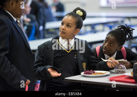 Pupils at Loreto High School in Chorlton, south Manchester eating school dinners cooked by top chefs Sukhdev Singh and Adam Leav Stock Photo