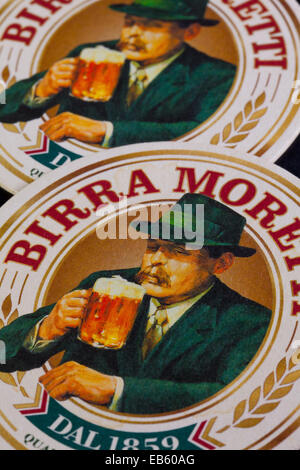 Budapest,Hungary-April 4,2014: Beermats from Birra Moretti - it was an Italian brewing company, founded in Udine in 1859 by Luig Stock Photo