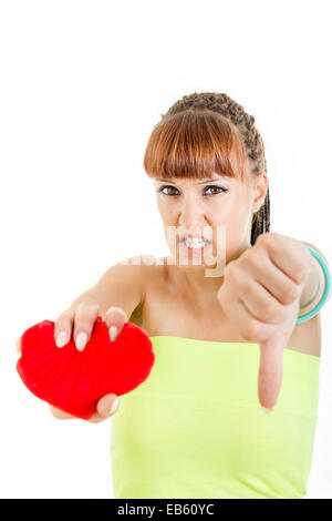 Sad woman with broken heart suffering from love showing sadness in her eyes and thumb down Stock Photo