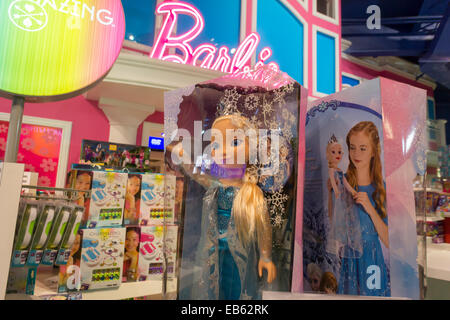 Disney's Frozen merchandise is seen in front of the Barbie display at Toys R Us in Times Square in New York Stock Photo