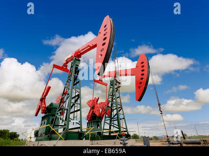 Working oil pump jacks on a oil field Stock Photo