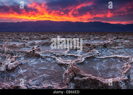 Fiery sunset over Badwater in Death Valley National Park. Stock Photo