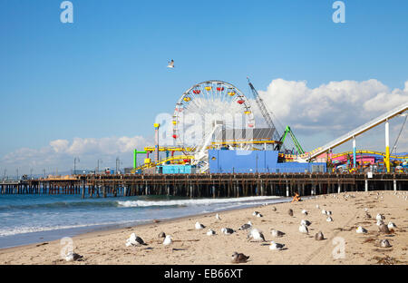 View of Santa Monica Pier and beach with seagulls - a famous local landmark in Santa Monica, California Stock Photo