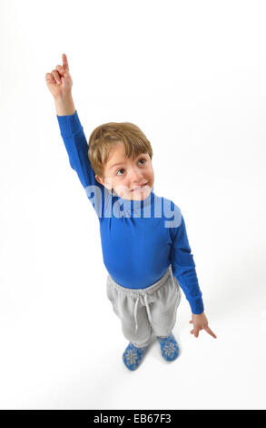 isolated little boy pointing upwards Stock Photo