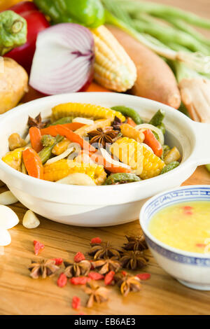 Assorted vegetables and cooked vegetable dish Stock Photo