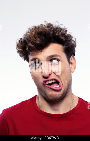 Portrait of a young man with funny expression on his face Stock Photo