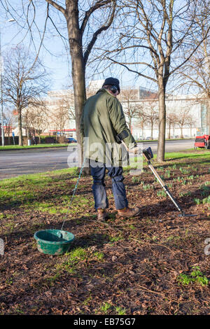 Detectorist using a metal detector in Derby, England, UK Stock Photo