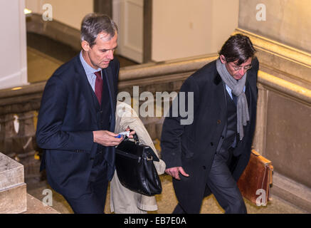 Munich, Germany. 27th Nov, 2014. Head of the Banking Federation Michael Kemmer (L) goes upstairs in palace of justice in Munich, Germany, 27 November 2014. The trial for the repayment of billions of credit payments to BaynerLB by its former subsidiary Hypo Alpe Adria continues with Schmidt's testimony. Photo: NICOLAS ARMER/dpa/Alamy Live News Stock Photo