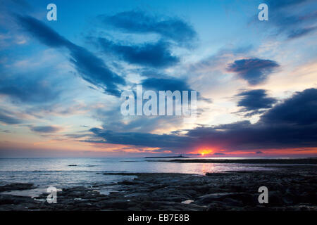 Clouds at Sunrise over Coquet Island Amble by the Sea Northumberland Coast England Stock Photo