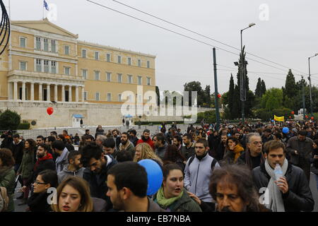 Athens, Greece. 27th November 2014. The protest march passes by the Greek Parliament. Tens of thousands Greeks followed the call by Greek Trade Union for a one day general strike and protest march to the Greek parliament. They protested against the austerity measures by the Greek government. Credit:  Michael Debets/Alamy Live News Stock Photo