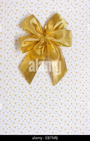 gold gift bow isolated and  background with stars Stock Photo